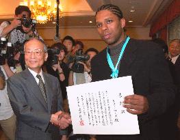 Rhodes receives Osaka honorary award and medal